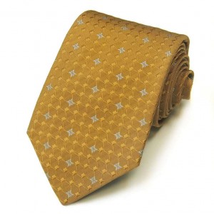 Горчичный шёлковый галстук Celine с мелким рисунком